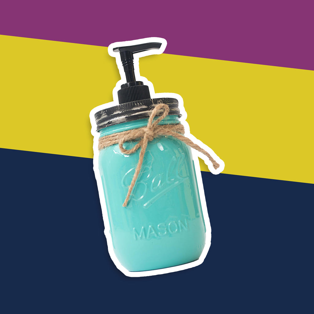 Turquoise mason jar soap dispenser with a pump on a striped background.