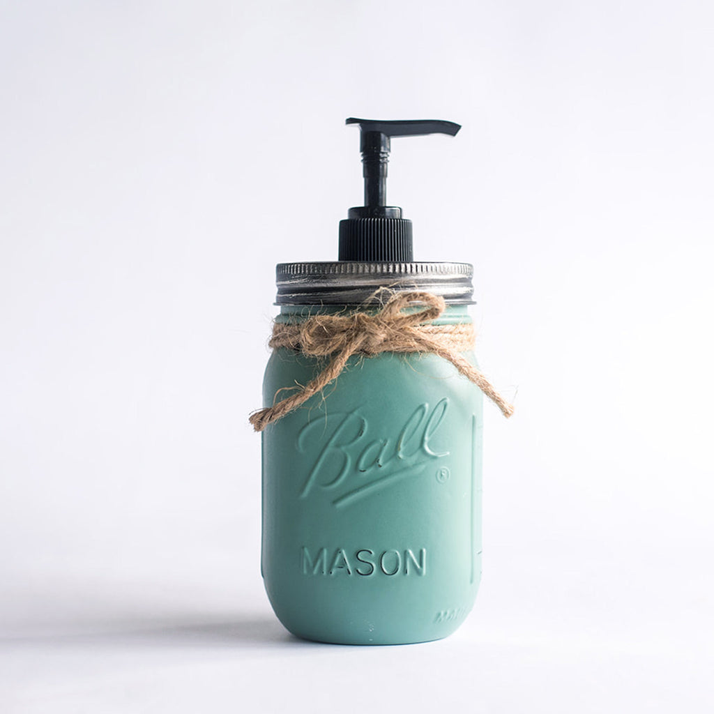 A teal mason jar soap dispenser with a pump on a white background.