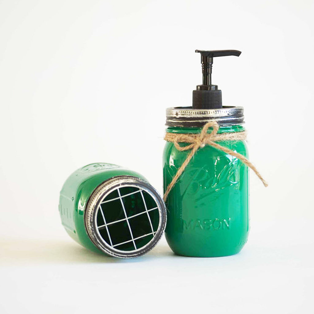 Green mason jar soap dispenser with pump on a white background.