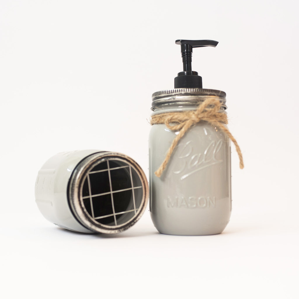 Mason jar soap dispenser with pump and lid on a white background.