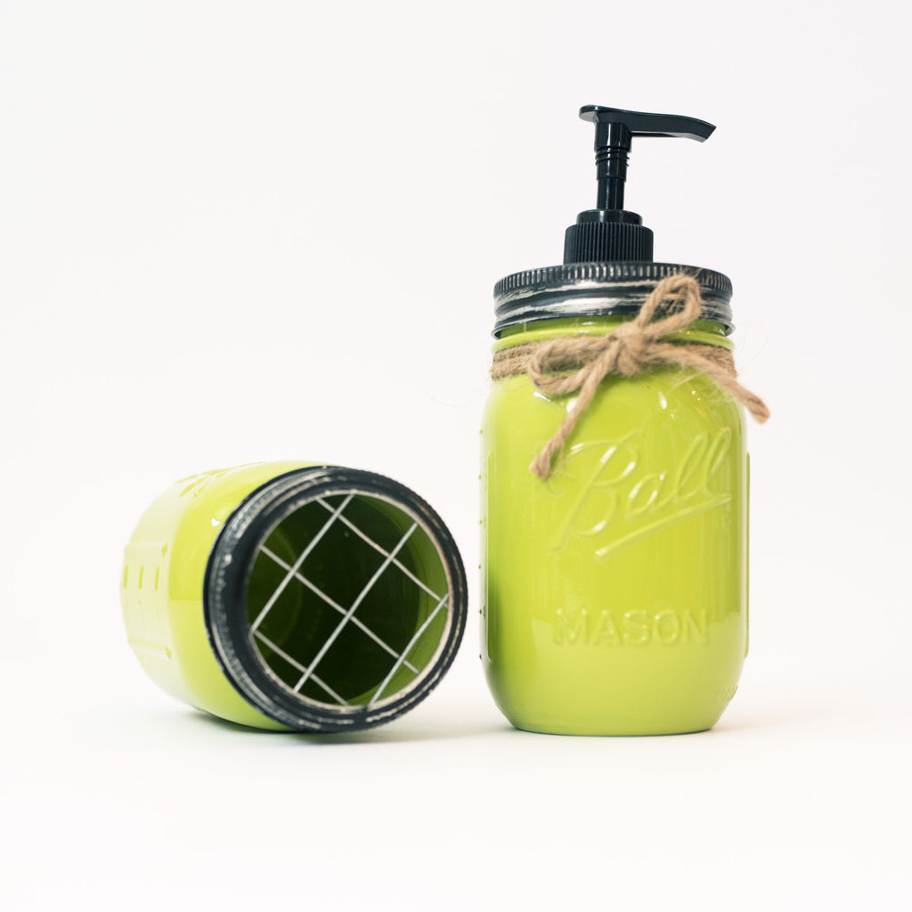 Green mason jar soap dispenser with pump on a white background.