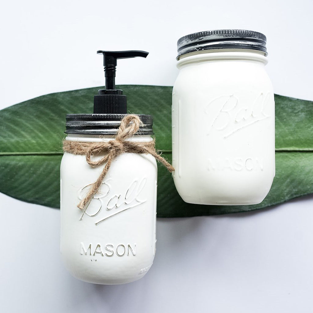 Two mason jar products on a white background with a green leaf.