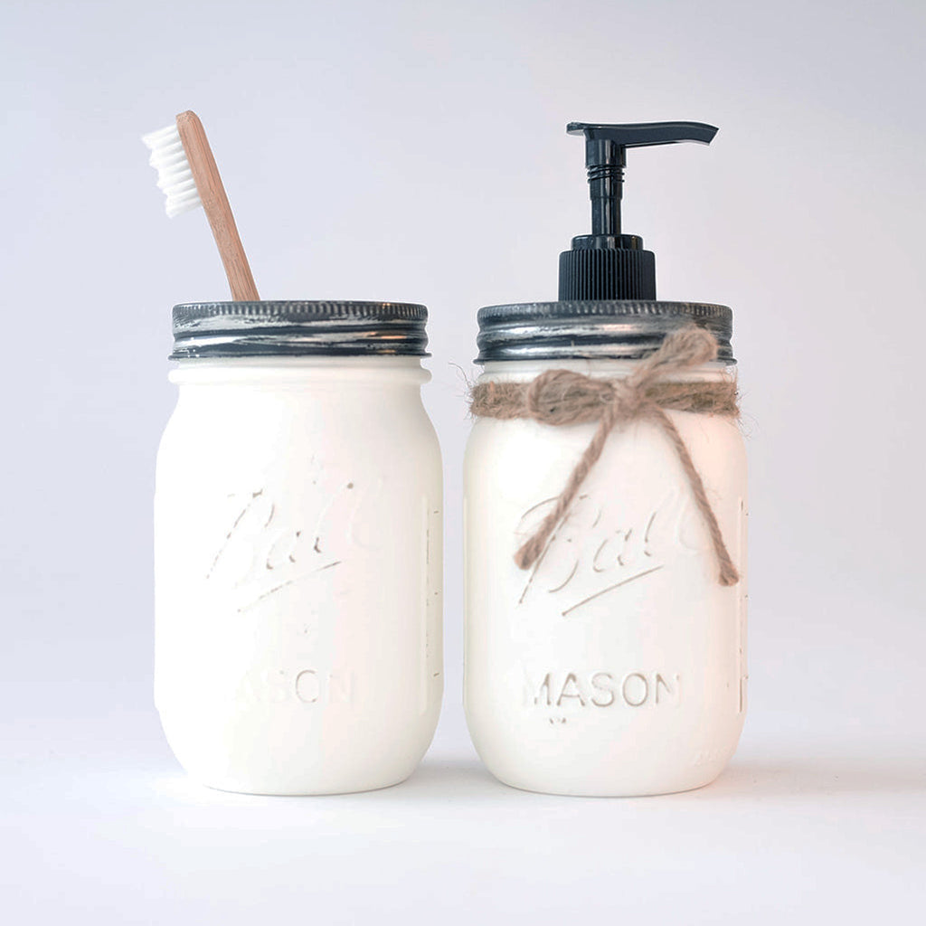 Two mason jar products on a white background, one with a pump and the other with a toothbrush holder.