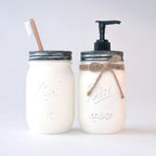 Two mason jar products on a white background, one with a pump and the other with a toothbrush holder.